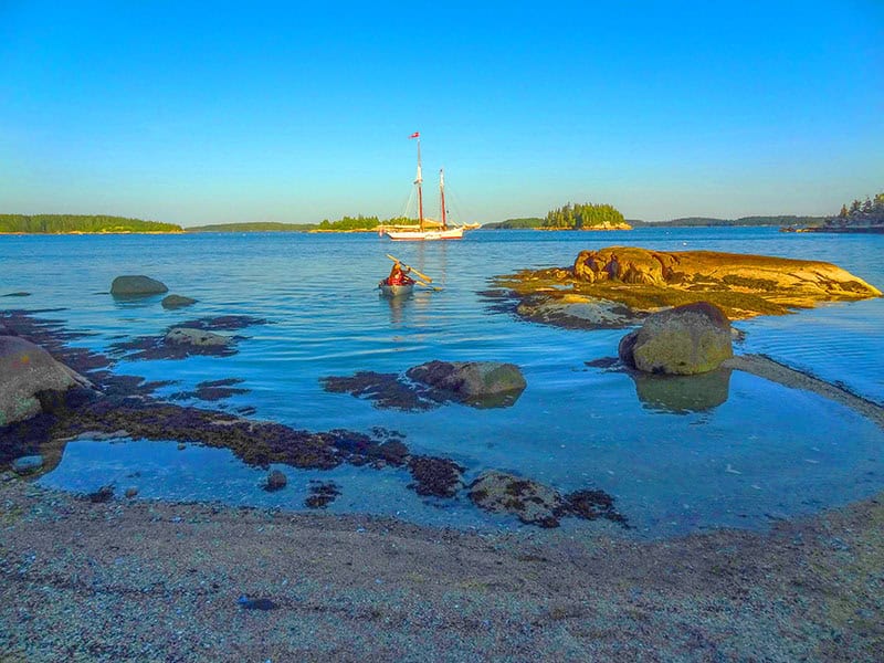 Crystal clear waters and rocky islands perfect for exploring - the essence of Maine island hopping